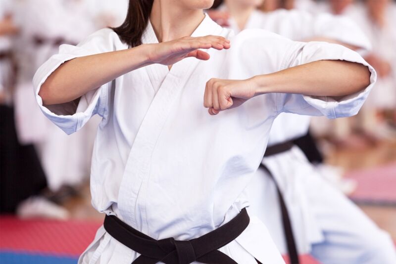 Female karate practitioner body position during training