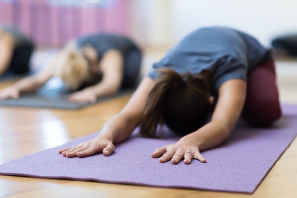 Women doing yoga training together
